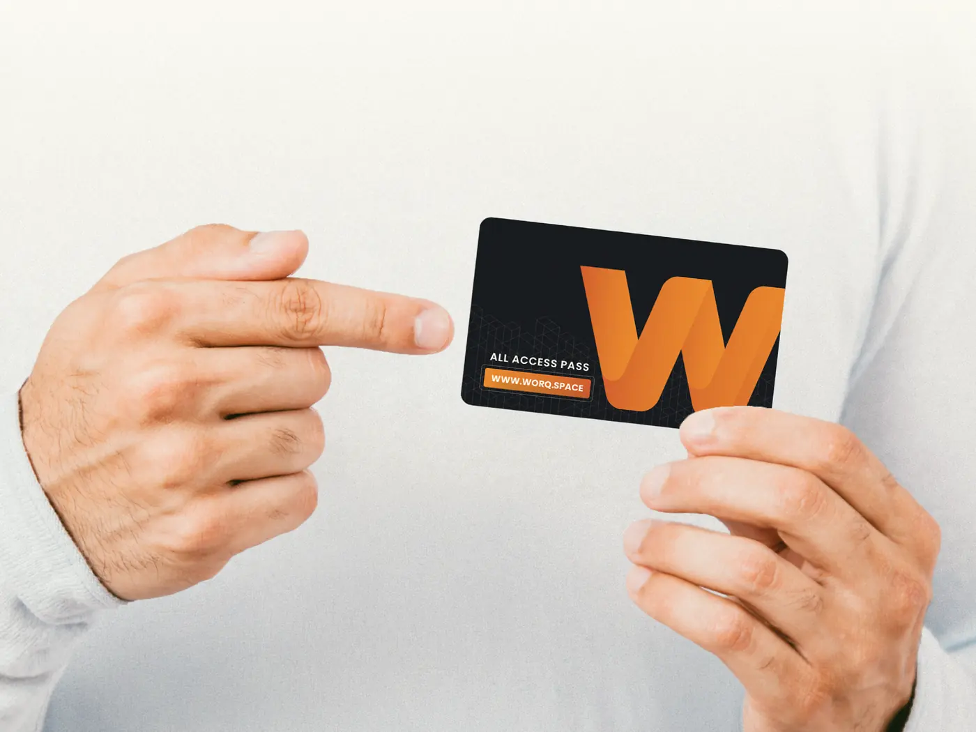 A member holding a WORQ all-access card